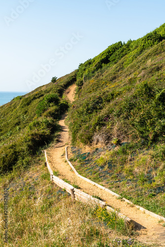 Trail in the hill of Bidart along the coastline with the ocean. Basque Country, France.