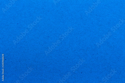 blue paper background texture light rough textured spotted blank copy space background in blue