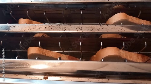 Bread lever in use on double toaster