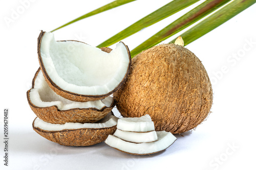 Coconut, Whole and sliced coconut on white background, showing white flesh and brown shell, ideal for food, health, and natural ingredient concepts