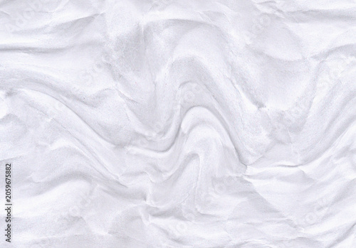 Crumpled white paper texture displays a chaotic folded surface with subtle shadows and highlights wrinkled creased rippled