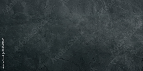 Vászonkép A close-up view of a dark, textured concrete wall reveals intricate patterns and subtle variations in shade, evoking a sense of raw, industrial aesthetics