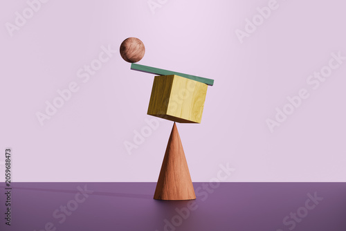 Balancing wooden geometric shapes creating abstract equilibrium