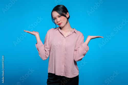 Young Indonesian woman gesturing with palms up