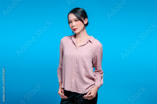 Portrait of a confident young Indonesian woman in a casual shirt