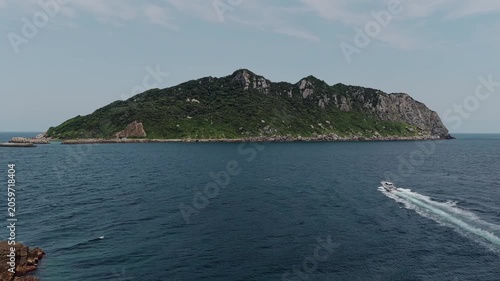 Drone footage of Okinoshima Island and coastal cliffs