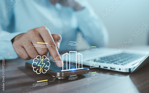 Obraz na plátne Ai energy consume data center, cloud server concept with business hand touching