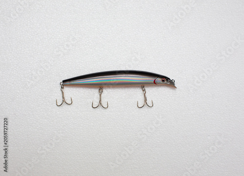 Artificial lure for shallow diving fishing, white background.
