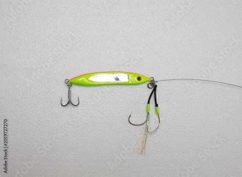 Micro jig fishing lure with white background.