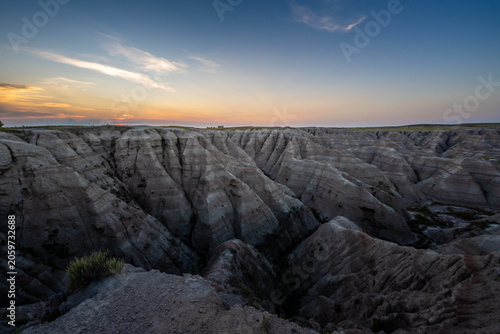 Badlands Canyon Landscape Under Dramatic Cloudy Sky in Badlands NP, South Dakota
