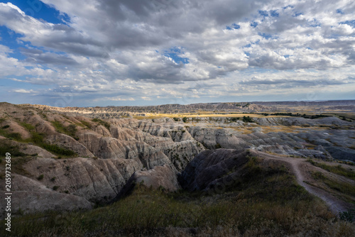Badlands Canyon Landscape Under Dramatic Cloudy Sky in Badlands NP, South Dakota