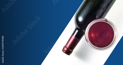 A glass and a bottle of red wine on a white background. Blue background for text.