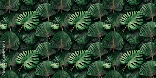 A vibrant array of lush tropical leaves creating a rich green backdrop, perfect for nature and design themes.