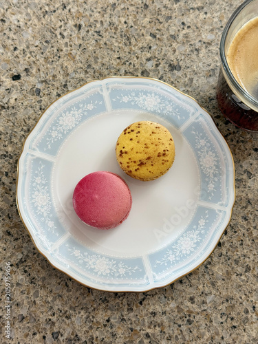 Macarons on the plate with coffee