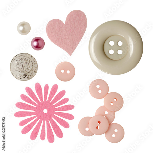 Cute pastel pink and cream sewing buttons with decorative felt flower and heart embellishments isolated on a white background. Elements for scrapbooking, packaging, greeting cards, scene creator.