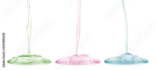 Transparent cosmetic gel or face serum product dripping in different colours, isolated on transparent background. PNG image.