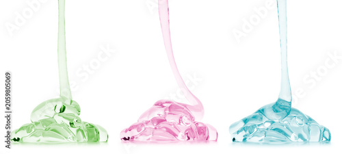Transparent cosmetic gel or face serum product dripping in different colours, isolated on transparent background. PNG image.
