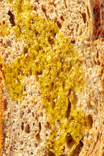 Slice of fresh artisan sourdough bread, with olive oil