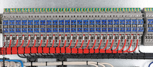 Marking electrical wiring wires with thermally printed nylon tape. 