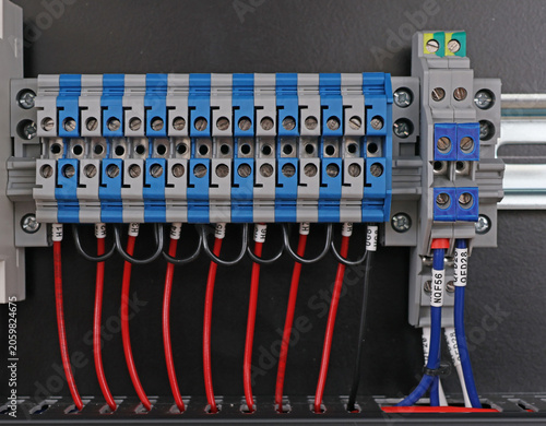 Marking electrical wiring wires with thermally printed nylon tape. 