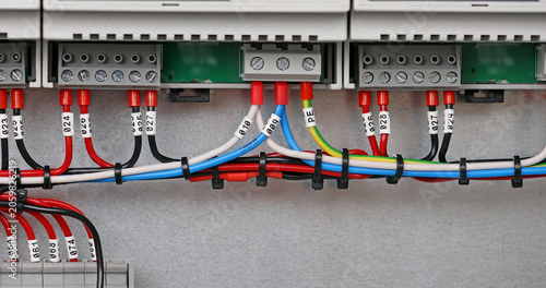 Marking electrical wiring wires with thermally printed nylon tape. 