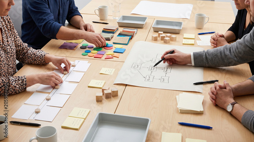 Collaborative workshop table with tactile tools and varied think