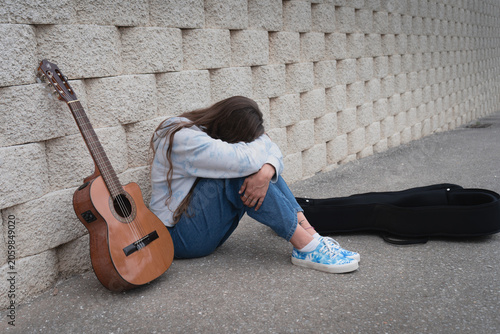 Young woman suffering from depression and creative block