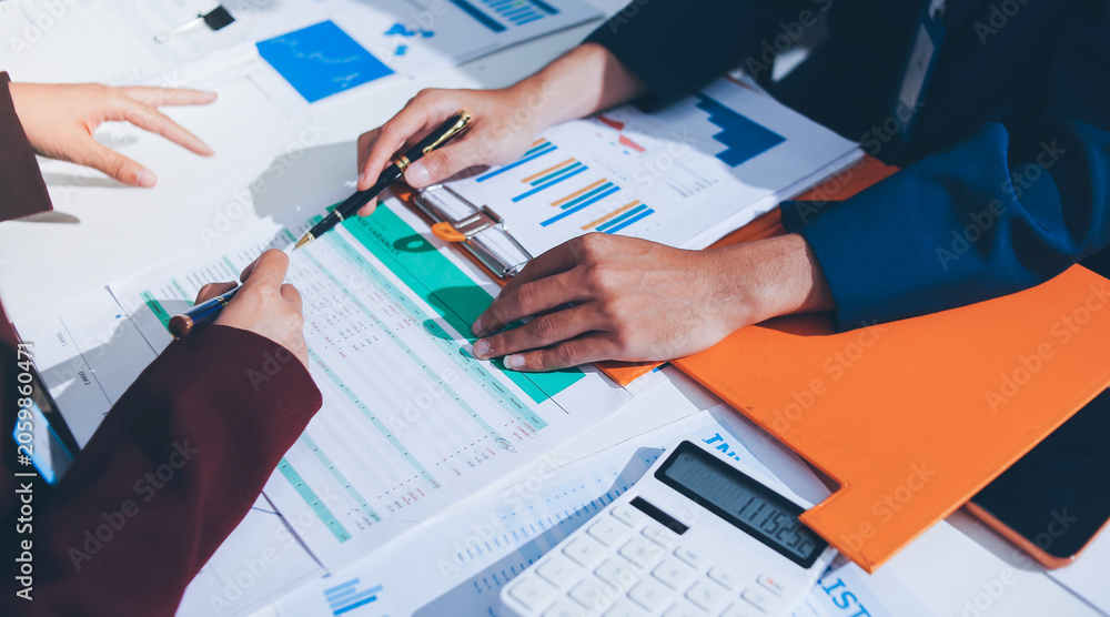 Fototapeta premium Accounting company provide finance and taxation planning for profitable cash flow, Auditor and accountant team working in office, analyze financial data and accounting record with calculator