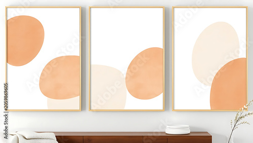 Abstract Trio: A set of three framed abstract art pieces featuring soft, organic shapes in warm peach and cream tones, creating a serene and modern aesthetic.