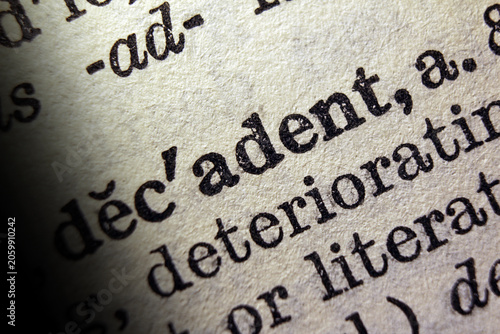 Slika na platnu Word decadent on dictionary page, macro close up