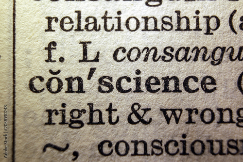 Photos Word conscience on dictionary page, macro close up