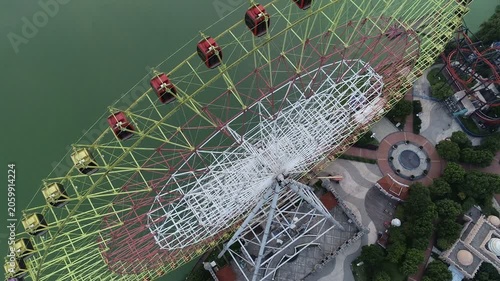Tilting drone footage of ferris wheel in Suzhou, China
