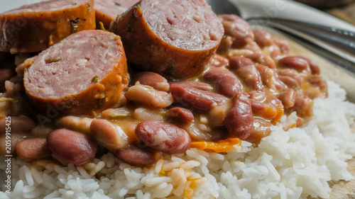 Canvastavla Rustic sausage and bean stew over rice, hearty comfort food close-up, savory hom