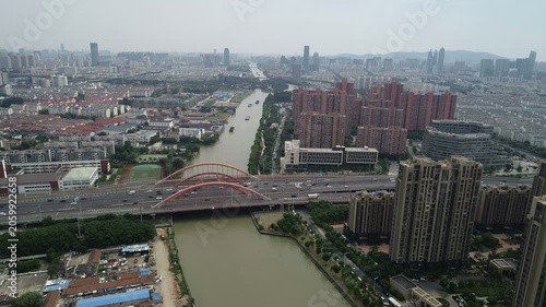 Aerial view of barges sailing through Grand Canal in suburbs of Suzhou, China