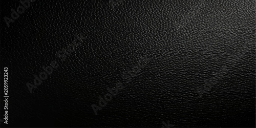 Obraz na płótnie A close-up textured background of rich black leather, showcasing its subtle grain and sophisticated, luxurious feel