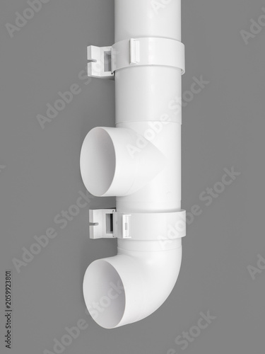 Billede på lærred White round plastic pipe on a gray background