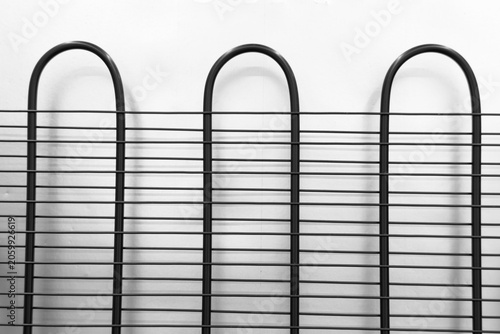 Cuadro en lienzo Black metal refrigerator condenser coils forming a horizontal and vertical grid