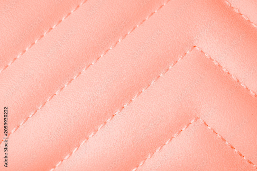Naklejka premium Textured soft peach quilted leather material with decorative chevron stitching pattern background