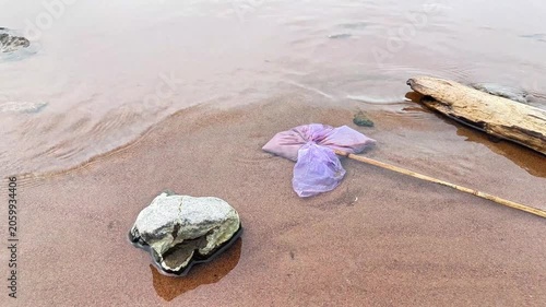 Plastic Bag Pollution on Beach Shoreline — Environmental Pollution Background for Films