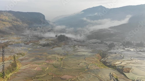 Panoramic drone flight of beautiful rice terraces and small community villages in Yuanyang, China