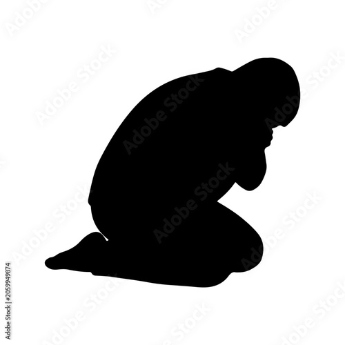 Silhouette of a person kneeling in prayer or despair.