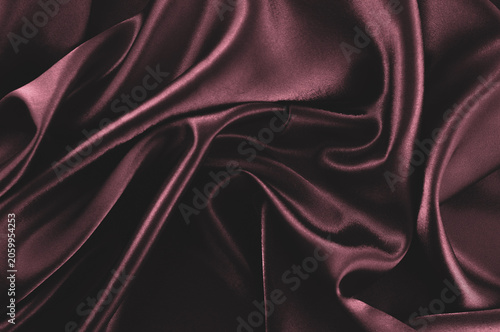 Foto Dark red silk fabric textured background