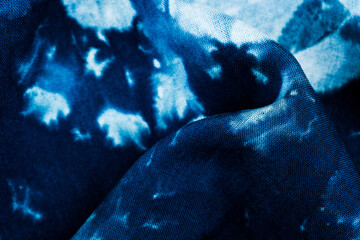 Close up of blue tie dye fabric texture with abstract shapes