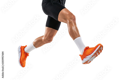 Canvastavla Close up of runner legs in orange sneakers sprinting