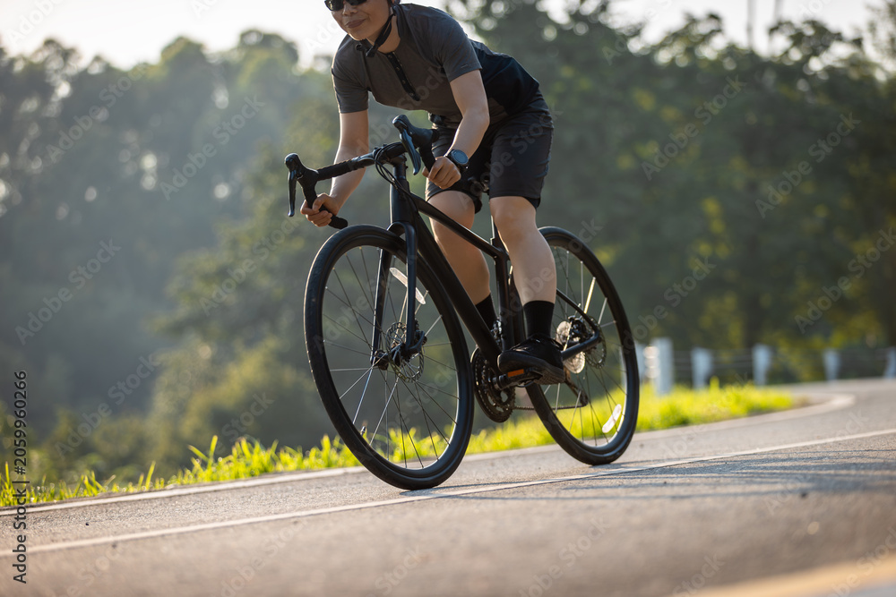 Naklejka premium People cycling on the greenway