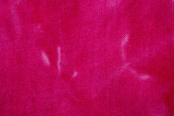 Macro view of pink tie dye fabric texture