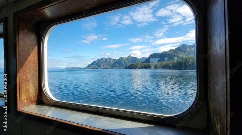 Fototapeta premium Scenic mountain landscape through window frame view.