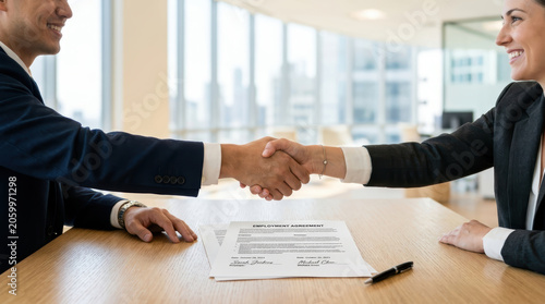 Signing an employment contract between employer and employee