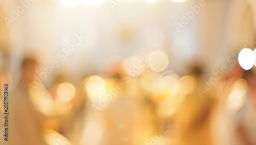 Warm festive golden bokeh background with elegant party lights