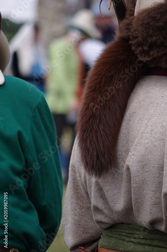 Φωτογραφία Participants in a historical reenactment or medieval festival wearing traditiona